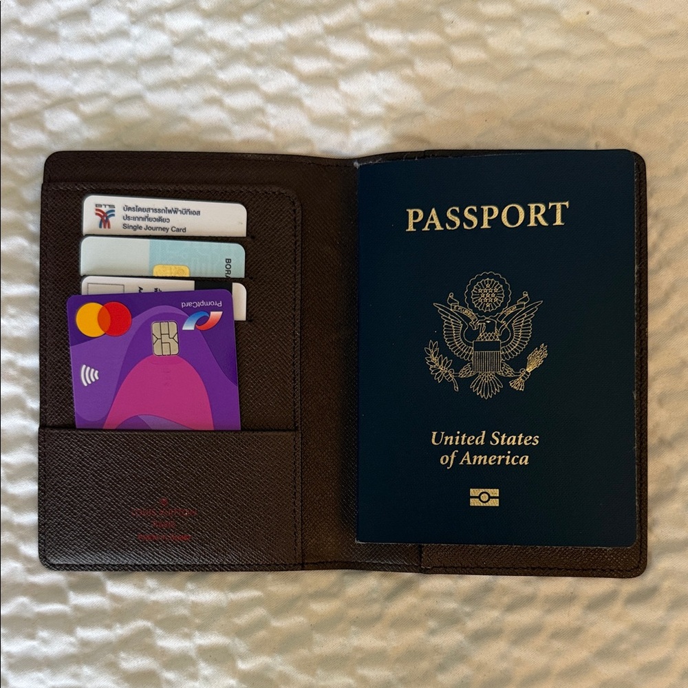 Elegant Textured Brown Damier LV passport Holder.
